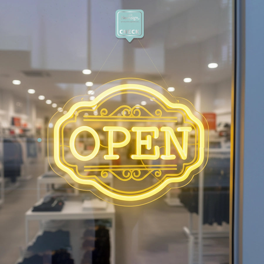 Neon 'OPEN' sign on a clothes store window with interior visible